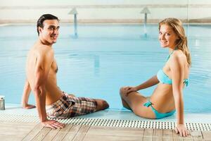 Couple at the swimming pool photo