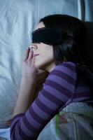 A young woman resting in the bed photo