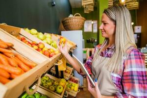 Woman working in a grocery store photo