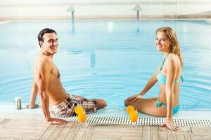 Couple at the swimming pool photo