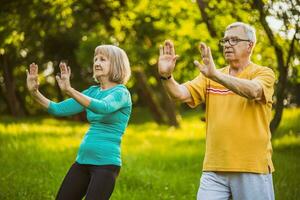 A senior couple doing physical exercises photo