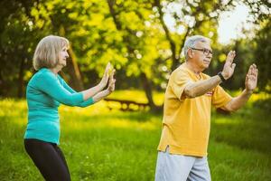 A senior couple doing physical exercises photo
