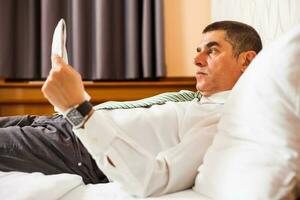 A businessman in a hotel room photo