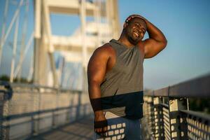 An African American man doing physical exercises photo