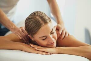 Woman enjoying a back massage photo