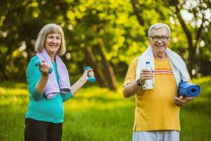 A senior couple doing physical exercises photo