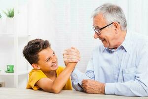 A grandfather spending time with his grandson photo