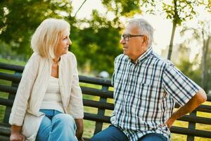 A senior couple spending time together in the park photo