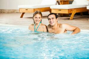 Couple at the swimming pool photo