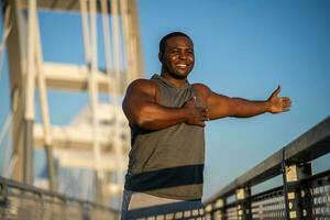 An African American man doing physical exercises photo