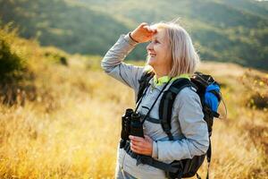 A senior woman hiking photo