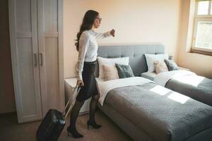 A businesswoman in her room after returning from a trip photo