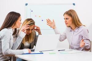 Businesswomen discussing a business plan photo