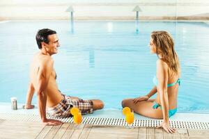 Couple at the swimming pool photo