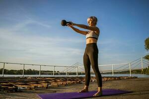 A woman doing physical exercises photo