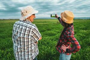 Farmers examining the crop. photo