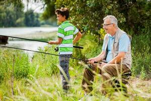 A grandfather and his nephew fishing photo