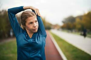 A young woman doing physical exercises photo