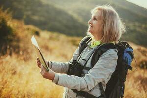 A senior woman hiking photo