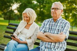 A senior couple spending time together in the park photo