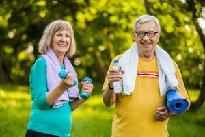 A senior couple doing physical exercises photo