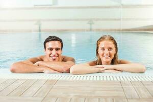 Couple at the swimming pool photo