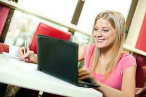 A woman using her laptop photo