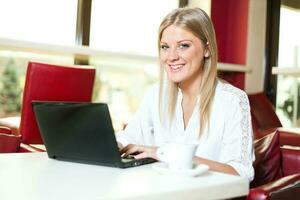 A woman using her laptop photo