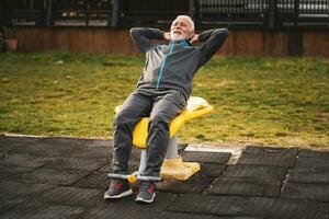 A senior man doing physical exercises photo