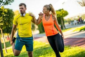 Young couple is exercising outdoor photo