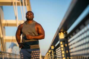 An African American man doing physical exercises photo