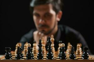 A man playing chess photo