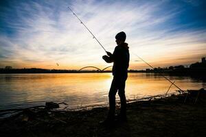 A boy is fishing on a sunny day photo