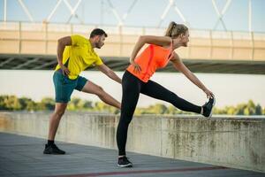 Young couple doing physical exercises photo