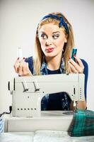 A woman with a sewing machine photo