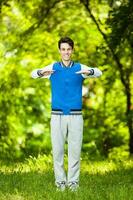 A man doing physical exercises outdoors photo