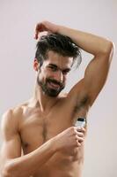 A man shaving his armpit photo