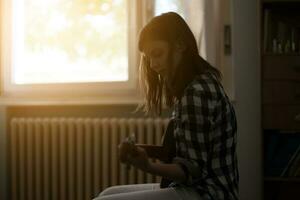 A teenage girl playing guitar photo