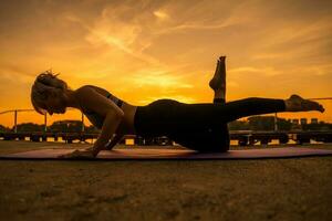 A woman doing physical exercises photo