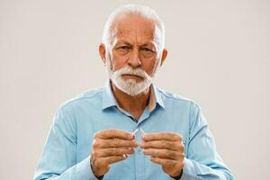 Senior man is decided to quit smoking photo