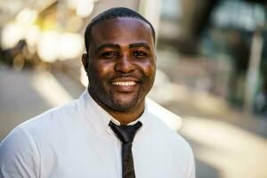 Portrait of a happy Afro businessman photo