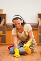 A woman cleaning the house photo