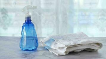 Spray bottle and towel on table video