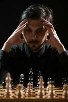 A man playing chess photo