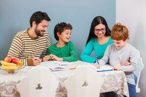 Parents helping their children with their homework photo