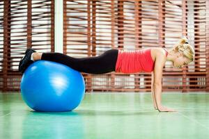 A woman doing physical exercises photo