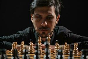 A man playing chess photo