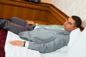 A businessman in a hotel room photo