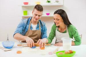 A couple cooking together photo