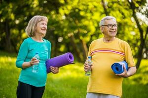 A senior couple doing physical exercises photo